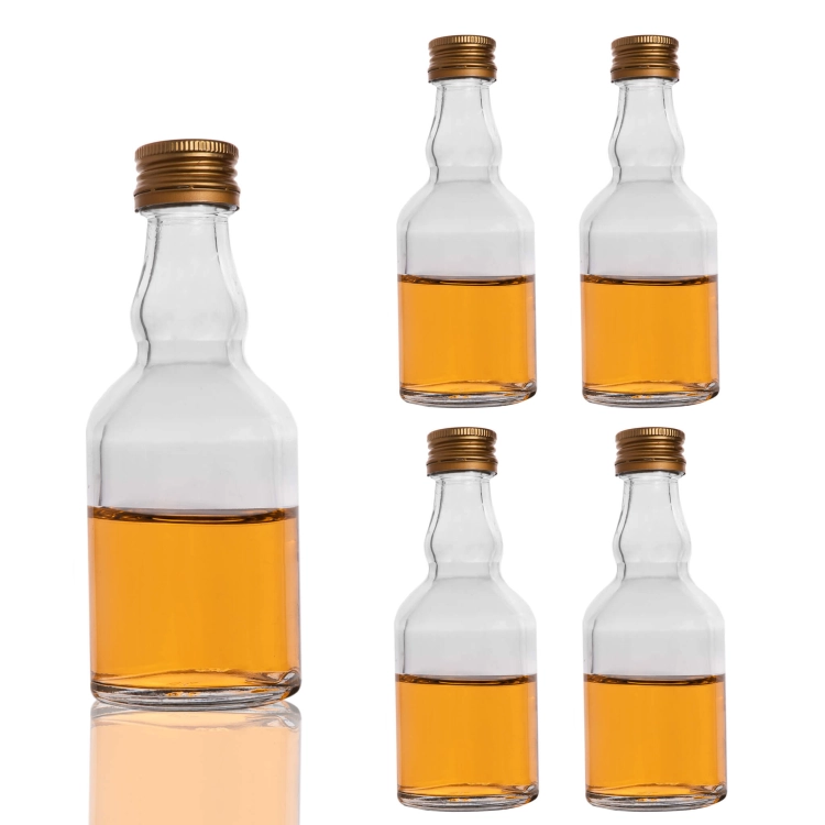 Butelka Elixir 50 ml – trzy małe butelki z bursztynowym płynem na białym tle
