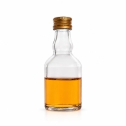 Butelka Elixir 50 ml – pojedyncza mała przezroczysta butelka ze złotą zakrętką na białym tle